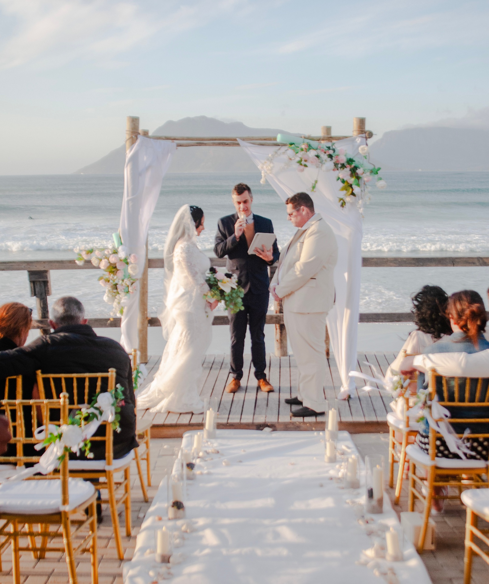 Beach ceremony with mountain backdrop