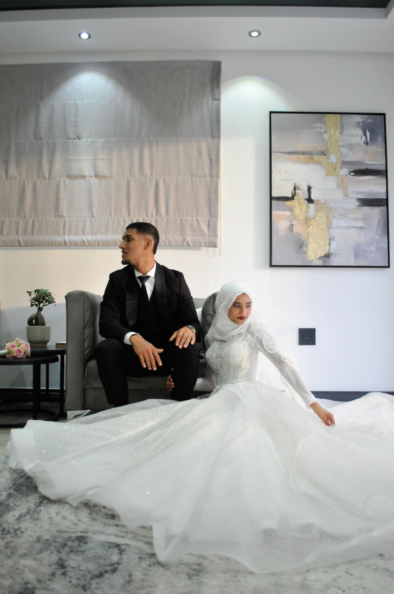 Bride in a sparkling gown beside her groom